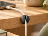 DESKFLOW Cable Clips & Ties Set concept: Single-channel detail — cable is a styling prop. AI concept visual; styling props not included.