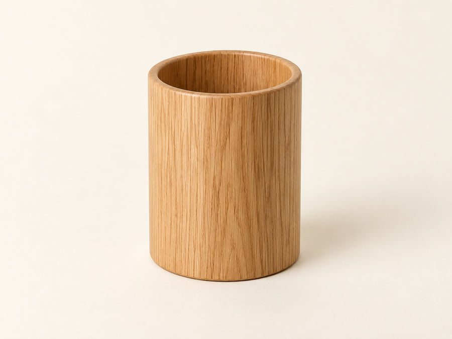 DESKFLOW Oak Desk Essentials concept: Empty oak pen cup; default unit. AI concept visual; styling props not included.