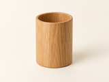 DESKFLOW Oak Desk Essentials concept: Empty oak pen cup; default unit. AI concept visual; styling props not included.